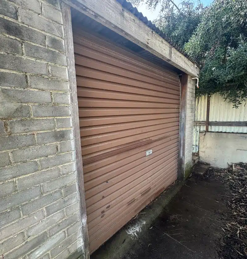 Rusty garage door exposed to the weather in Perth